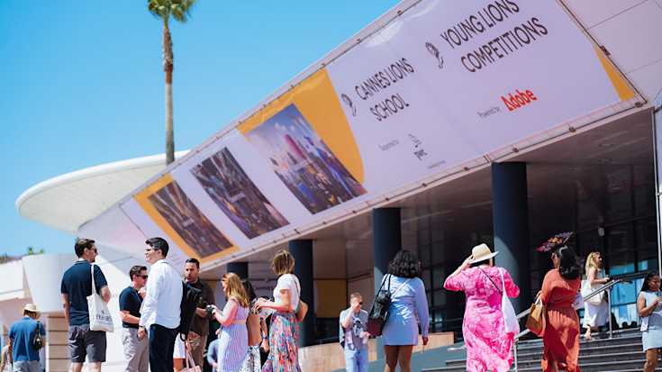 Signs mentioning learning and talent initiatives at Cannes Lions.