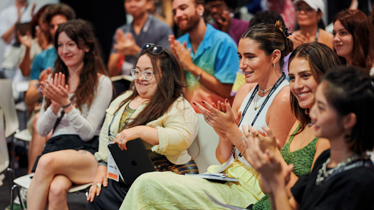 The audience applauding at the Creative Academy at Cannes Lions.