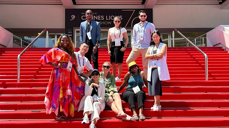 Members of the Jodi Harris Scholarship cohort on the stairs at Cannes Lions.